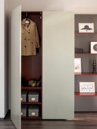 The left column of this closet is intended for wardrobe, organized with hanging tube and shelves