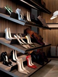 Inclined shoe shelves with metal frame and heel bars