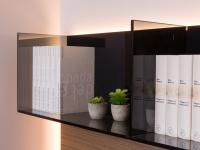 Smoked glass bookcase, a contrasting element against the warmth of wood in this version of the Replay 04 wall unit