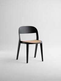 Minima chair in black wood with Vienna straw seat, shown here in the version without armrests