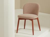 Modern chair upholstered in fabric with matt lacquered beechwood legs in Orange Earth colour