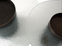 Detail of the round hammered glass tops, one of the finishes available to customize the Bullet coffee table