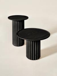 Shinden pedestal coffee table in black-stained ash, a finish that enhances its minimal, sculptural character