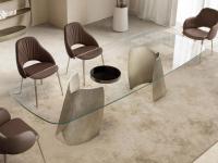 Akeyo shaped glass-topped table combined with a set of Camille chairs