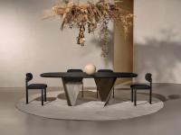 Birkey living room table with Absolute Black ash wood top and curved sheet metal legs (version with inward curvature)
