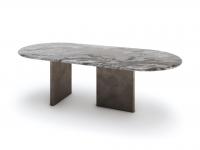 Detail of the statuesque, monolithic effect of the Dandelion table with Camouflage marble top, here with perpendicular metal legs