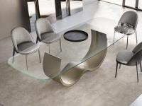 Table with designer metal Hadley base and clear glass top